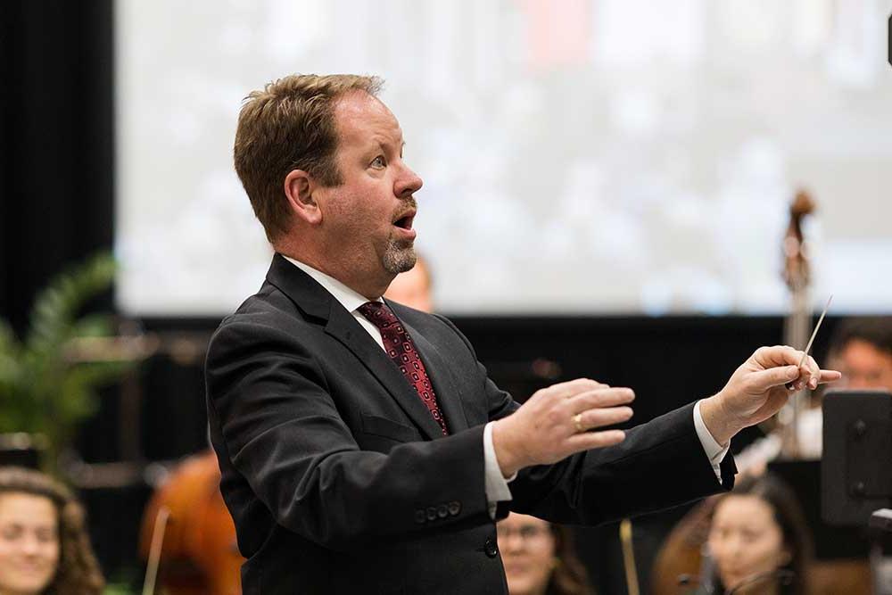 Conductor directing the orchestra